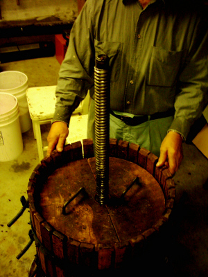 After the grapes are placed in the press, pressure forces the juice out of the grapes.